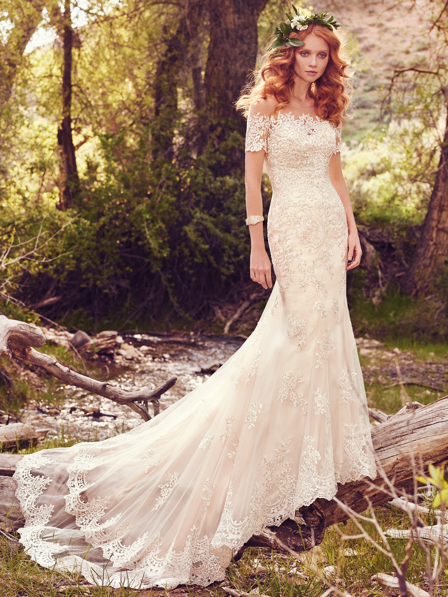 This romantic A-line features a bodice of embellished lace appliqués and an allover lace and tulle skirt - Reynold wedding dress by Rebecca Ingram