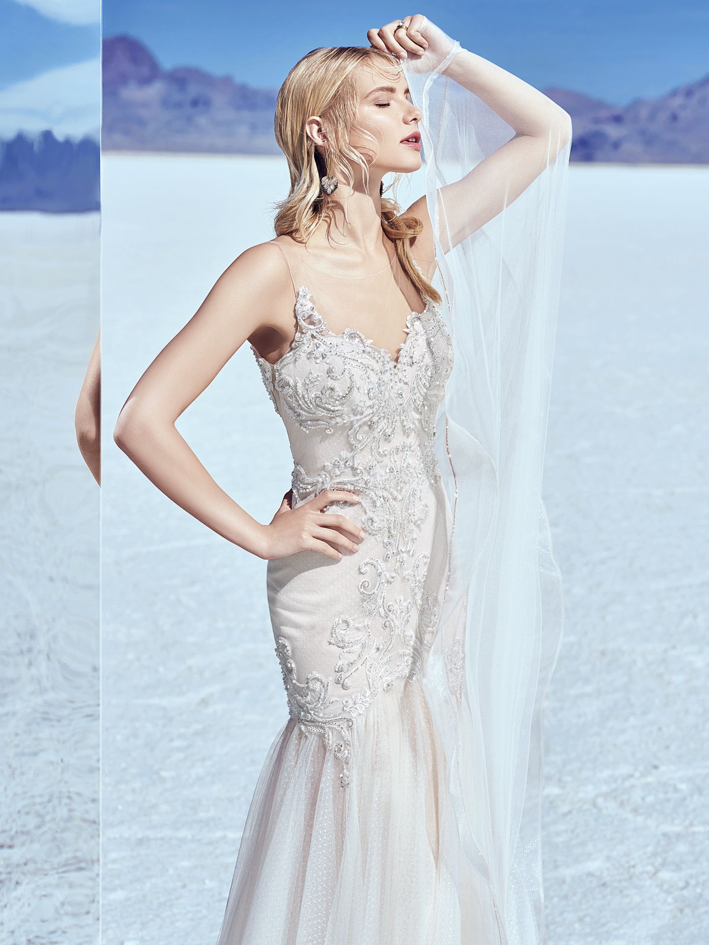 Khloe by Sottero and Midgley. Beaded lace motifs accented in Swarovski crystals dance over dotted tulle in this sexy wedding dress, completing the illusion sweetheart neckline and illusion V-back. Fit-and-flare skirt accented in horsehair and rhinestone trim. Lined with Naveen Jersey for a luxe fit.  10 Top-Pinned Sottero and Midgley Gowns of 2017.