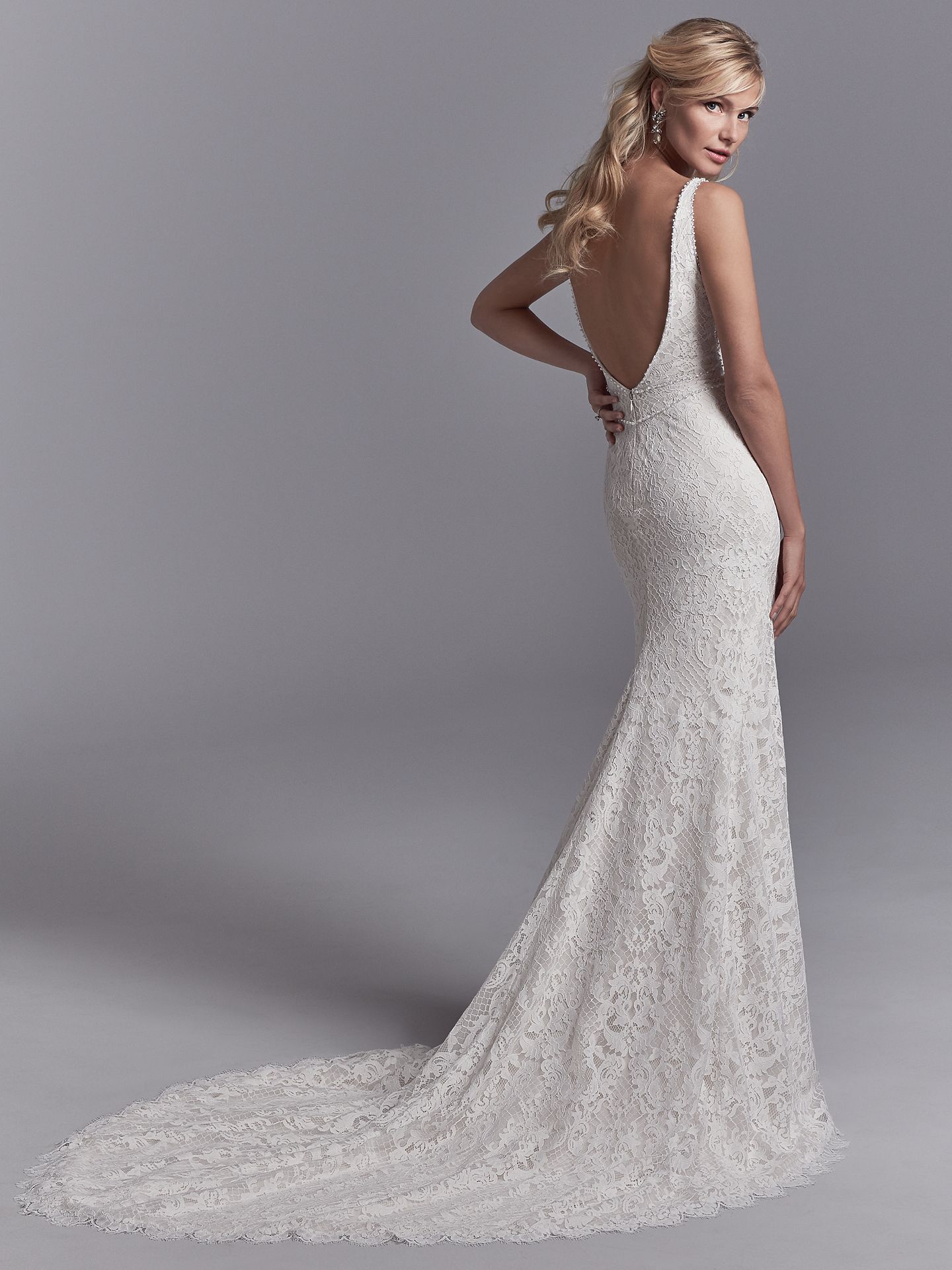 Regan wedding dress features allover lace motifs cascade over crosshatched tulle in this fit-and-flare wedding dress. - The Latest Wedding Dress Trends for Engagement Season 2018